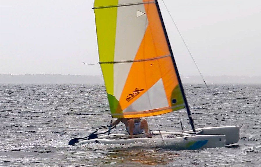 A beginner Hobie sailing safety graphic covering life jackets, weather checks, controlled movement, and basic tacking awareness.